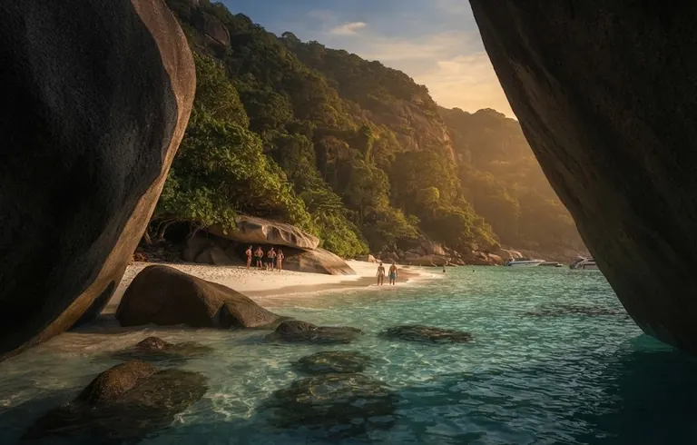 Calm bay and a small wooden hut seen through a gap between two giant granite boulders