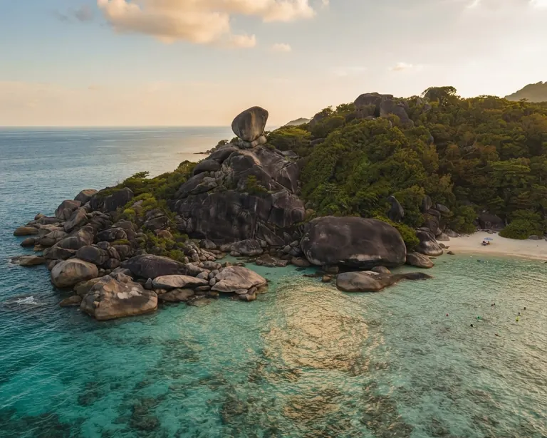 Sail Rock headland above shallow coral and turquoise water