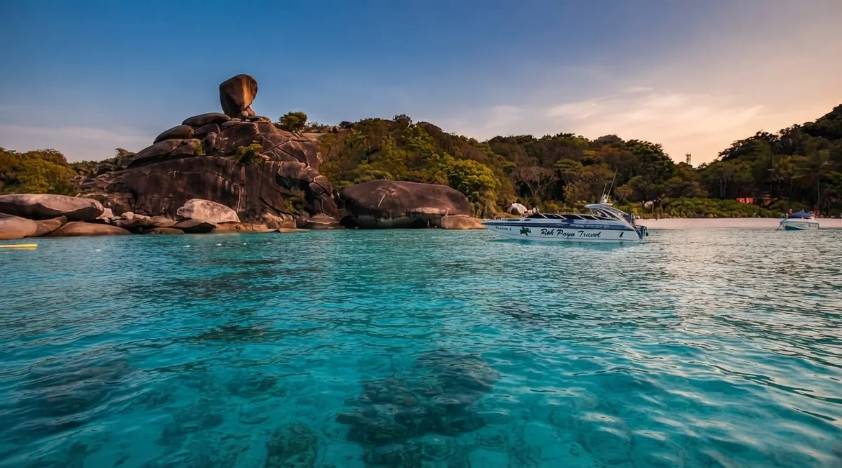 Speedboats in turquoise water below Sail Rock